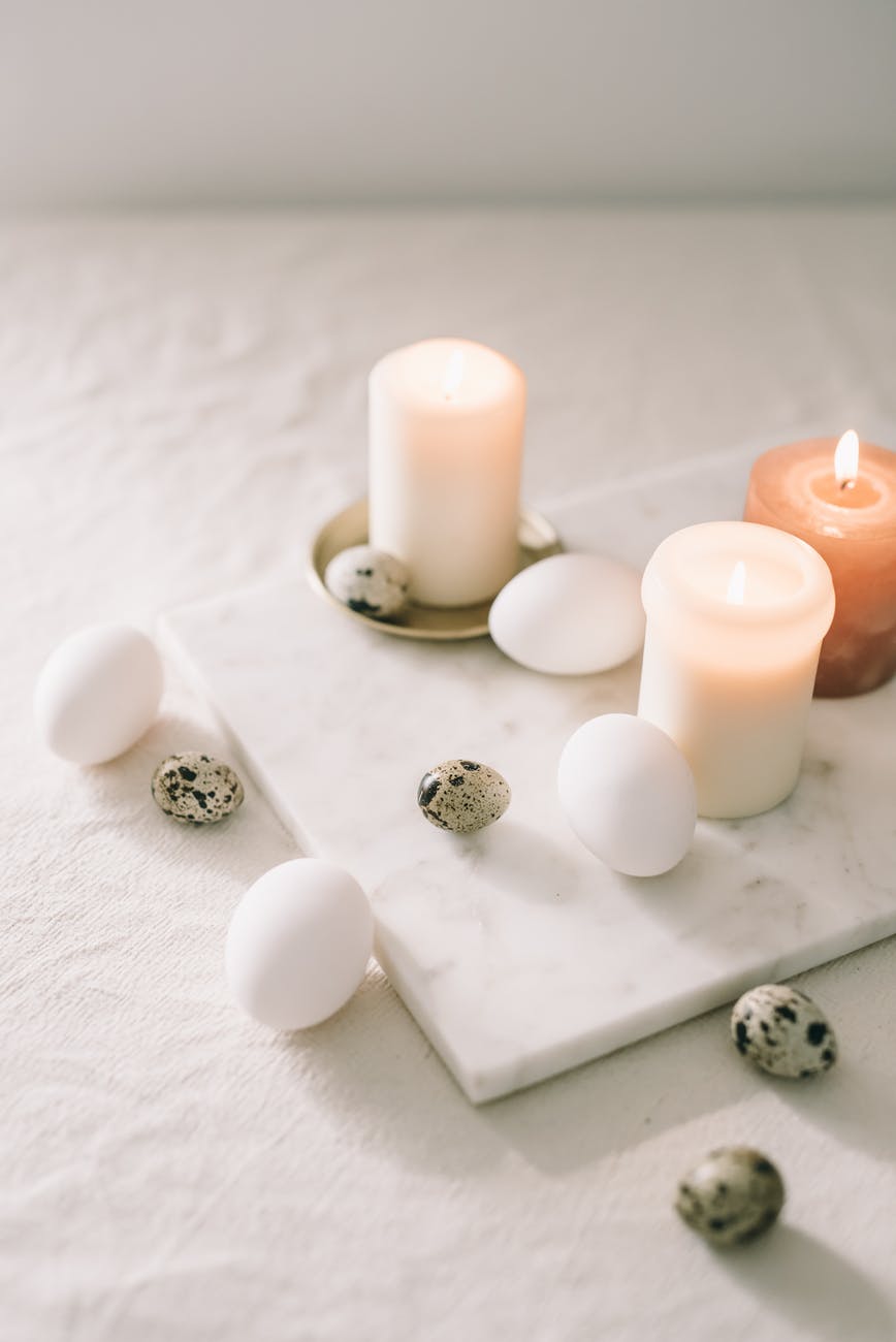eggs and lighted candles on marble top